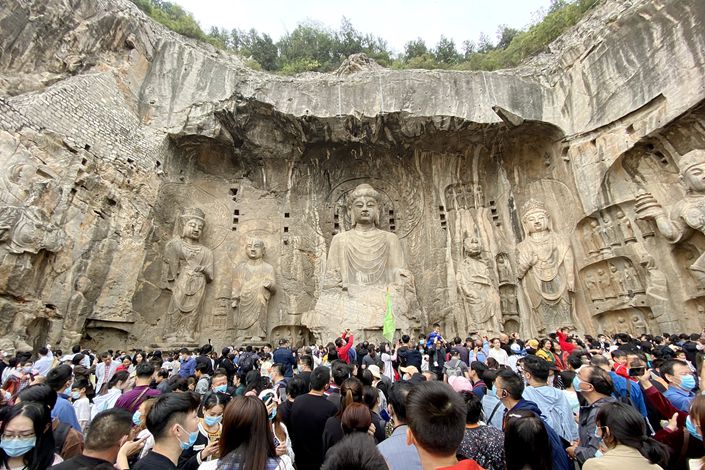 A crowd gathers at the Longmen Grottoes on Oct. 4 in Luoyang, Central China’s Henan Province.