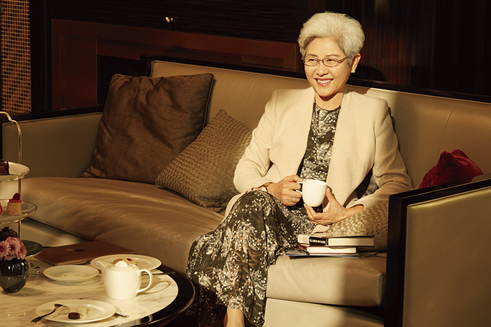 Fu drinks tea during a banquet.